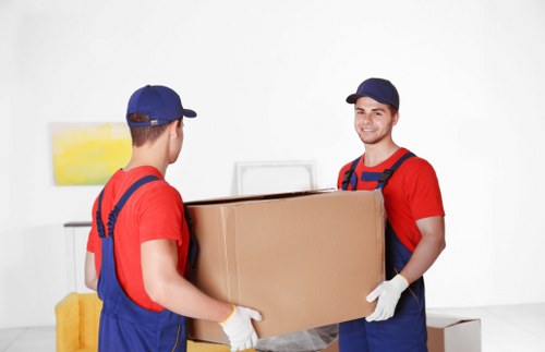 Packed moving boxes and furniture ready for local removals