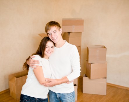 Professional flat removal team handling furniture in Cambridgeheath